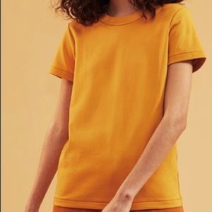 Never worn! Uniqlo U crew neck tshirt in orange.